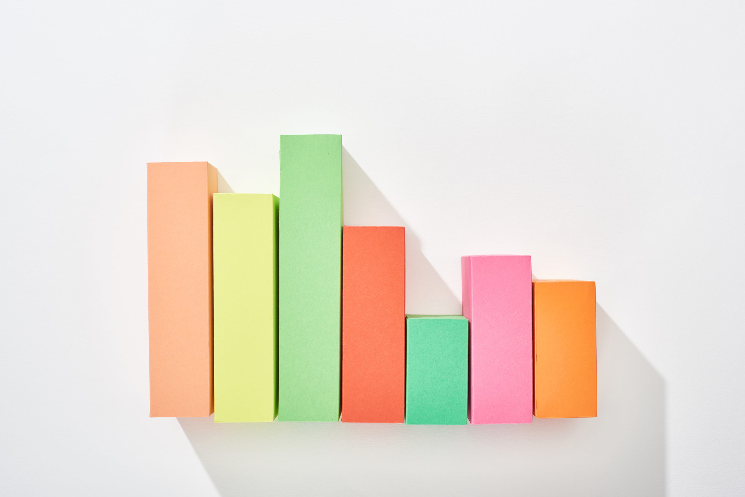 top view of multicolor analytical graph with shadow on white background